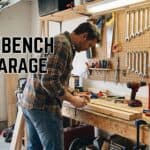 Workbench setup with tools in a garage workspace.