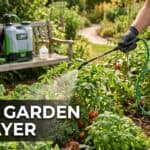 Person using a garden sprayer to water plants in a lush garden setting.