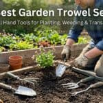 Gardener planting with a garden trowel in a lush garden bed.