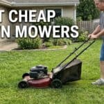 Man mowing lawn with a budget-friendly lawn mower in a suburban yard.