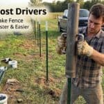 Man using a T post driver to install fence posts in a field.