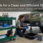Automotive tools and car lift for oil change in garage.