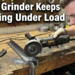 Man inspecting angle grinder that keeps stopping under load.