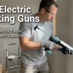 Electric caulking gun being used for home sealing by a man.