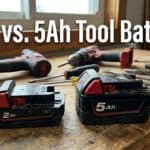 Comparison of 2Ah and 5Ah power tool batteries on workbench.