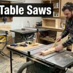 Man using a table saw in a woodworking workshop for carpentry projects.